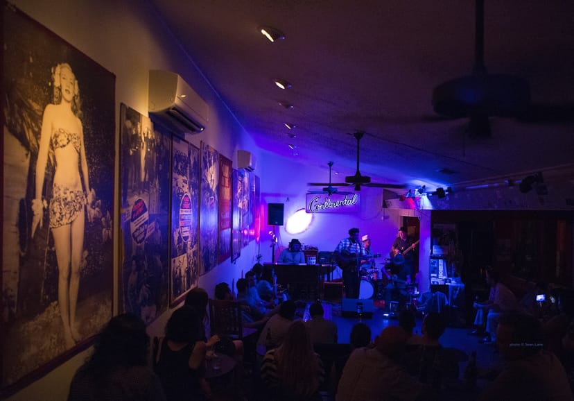 Intimate live music venue at Shoeshine Charley's for social mixers and corporate events.