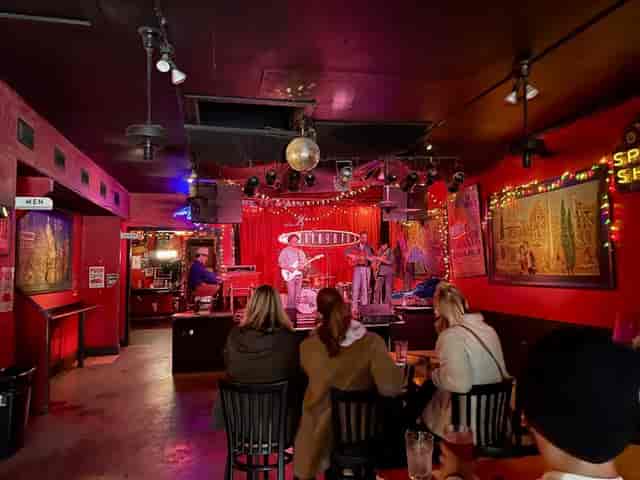 Vibrant live music venue with colorful lights ideal for intimate events and gatherings.