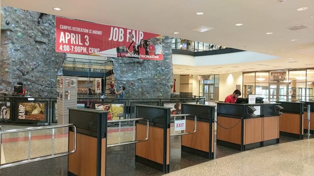 Natatorium reception area at University of Houston for job fair events, organized and welcoming.