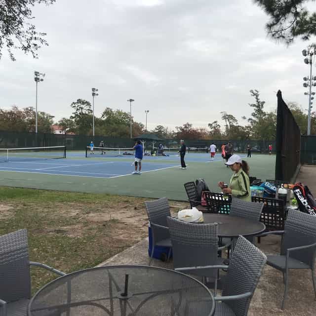 Outdoor tennis courts in Houston for team-building events and recreational retreats.