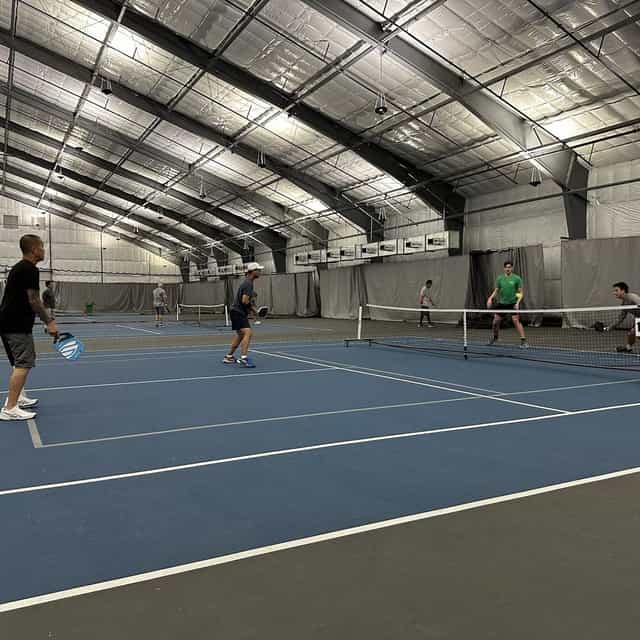 Indoor tennis courts in Houston, perfect for team-building events and corporate retreats.