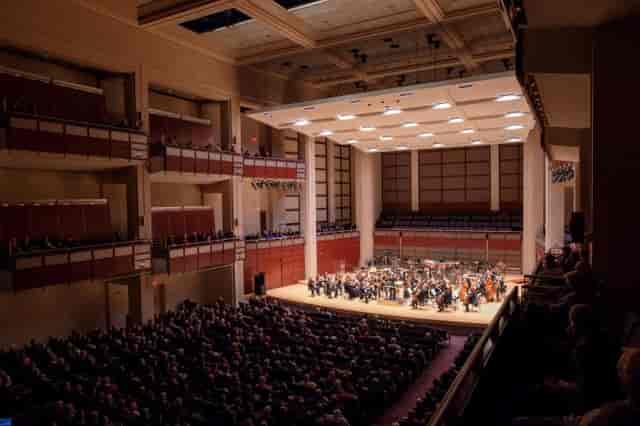 Raleigh Memorial Auditorium concert hall with orchestra, ideal for live performances and events.