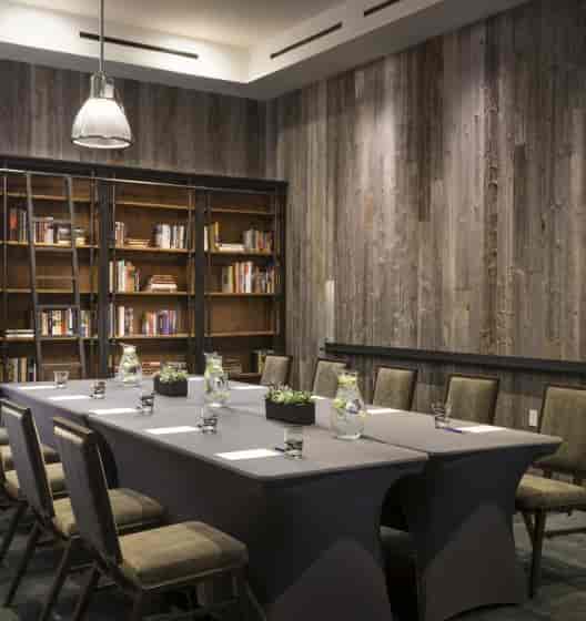 Meriwether Ballroom in Hotel Van Zandt: modern meeting room with wooden accents, ideal for events.
