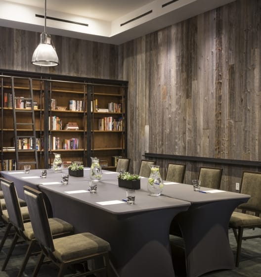 Meriwether Ballroom in Hotel Van Zandt: modern meeting room with wooden accents, ideal for events.