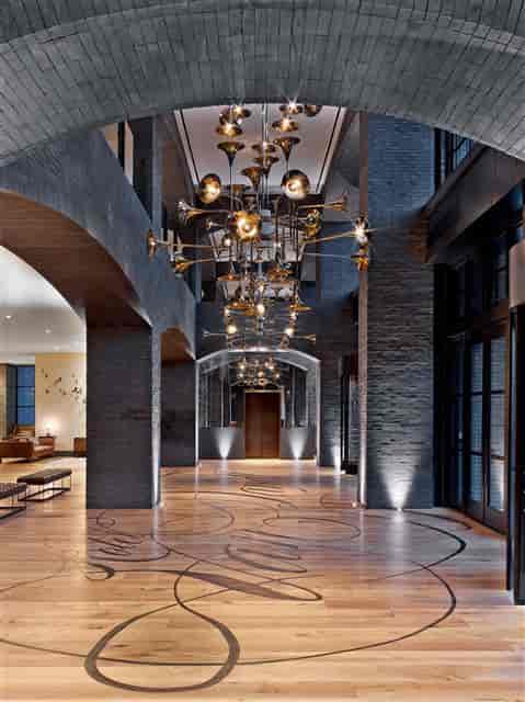Meriwether Foyer at Hotel Van Zandt with brass horn chandelier for upscale events.