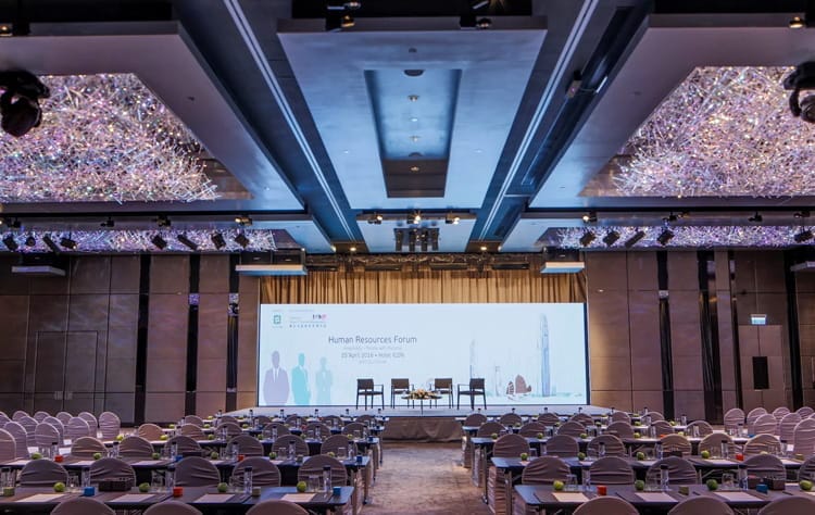 Elegant conference centre with chandeliers, ideal for forums and networking events.