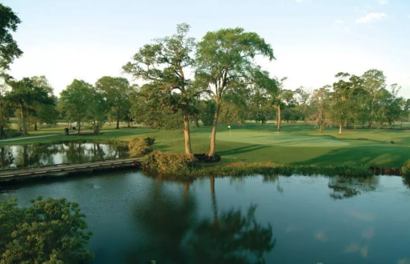 Formal dining room at Champions Golf Club with serene water feature for outdoor events.