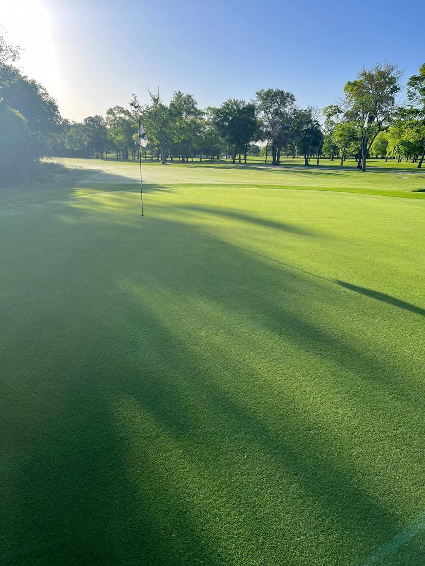 Pavilion at BlackHorse Golf Club with manicured green for outdoor corporate events.