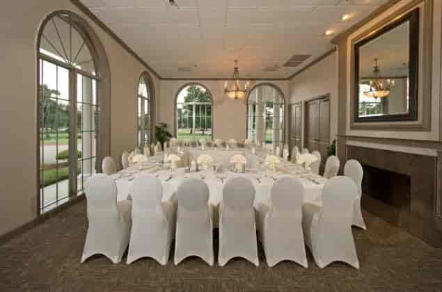 Elegant event space with round tables for corporate gatherings at Sugar Creek Country Club.