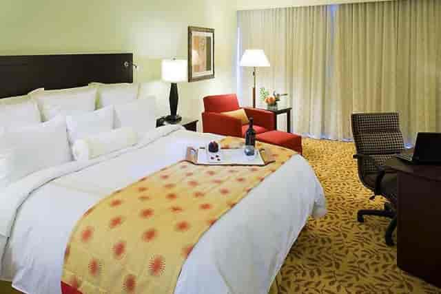 Spacious business hotel room with plush bed at Houston Marriott Energy Corridor.