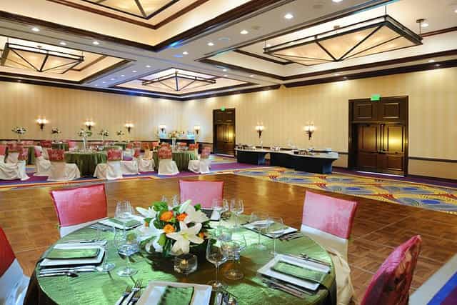 Elegant ballroom at Houston Marriott for weddings and corporate events with floral decor.