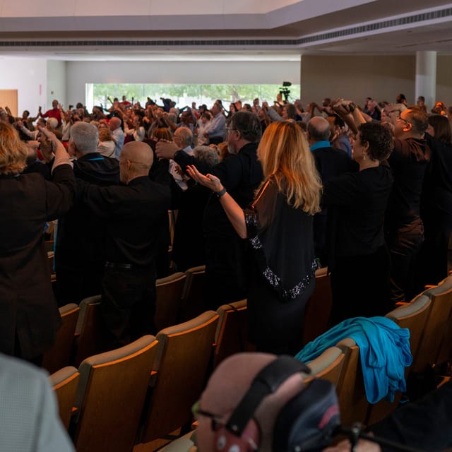Engaged audience at Unity of Houston chapel during a conference event.