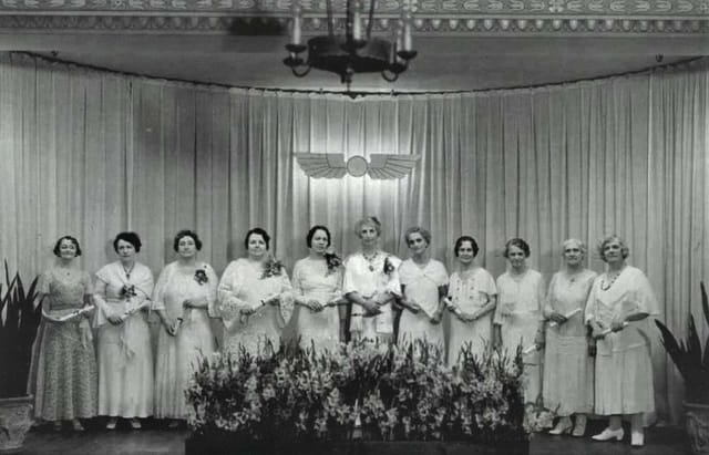 Elegant women's gathering at Pyramid, Unity of Houston; recognition ceremony, floral decor.