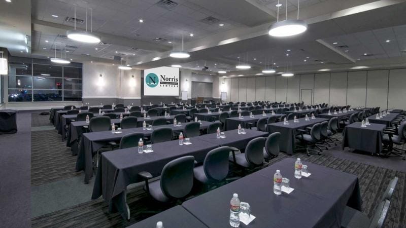 Meeting room with spacious tables for corporate conferences and workshops.