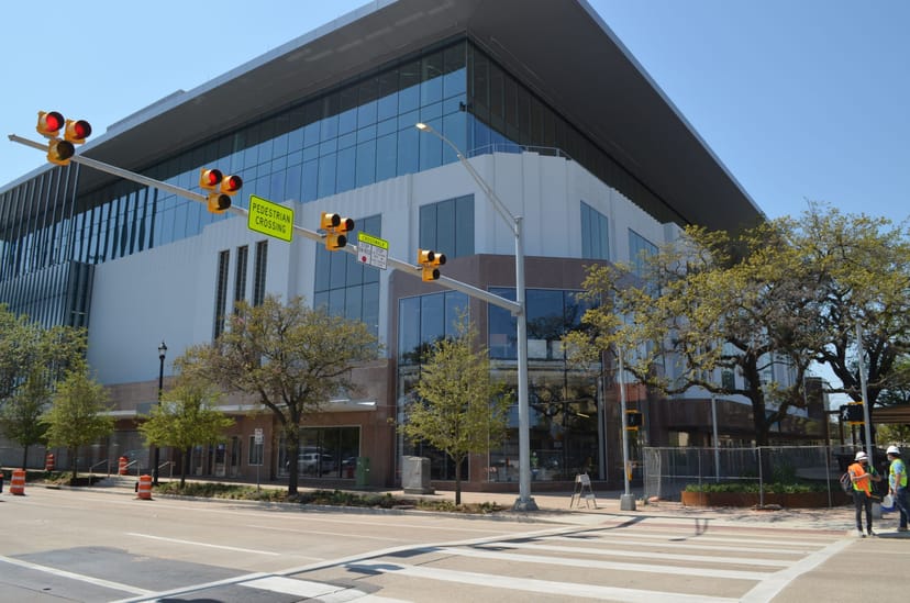 Modern conference center, sleek glass facade, ideal for meetings and events in Greater Houston.