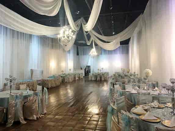 Elegant reception hall in The Gardens Houston, featuring a chandelier for weddings and events.