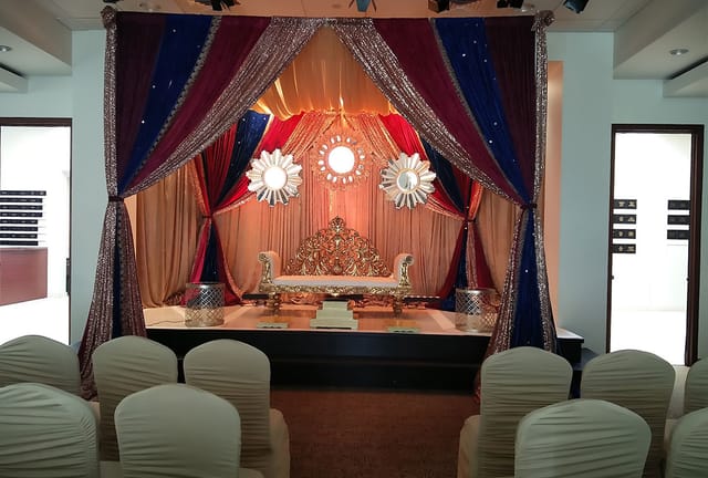 Function Room in India House with ornate stage, ideal for ceremonies and celebrations.