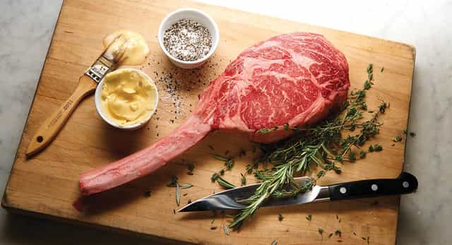 Marbled tomahawk steak at Pappas Bros. Steakhouse, ideal for culinary events and tastings.