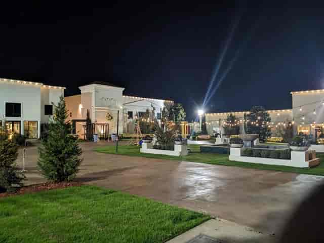 Dallas Palms outdoor wedding venue illuminated with string lights for events.