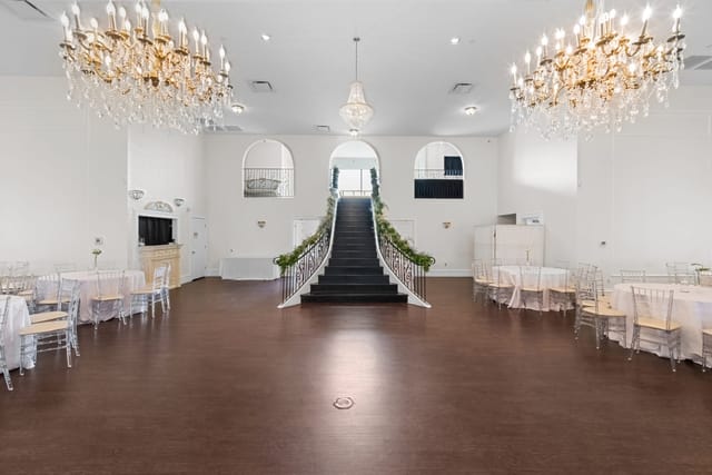 Bel Air Ballroom in Dallas: elegant chandeliers & staircase for weddings or corporate events.