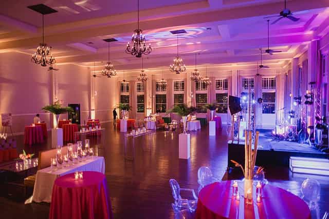 Main Ballroom at The Room on Main with elegant chandeliers for corporate events and celebrations.