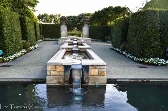 Elegant outdoor venue with tranquil fountain for garden receptions in Dallas.