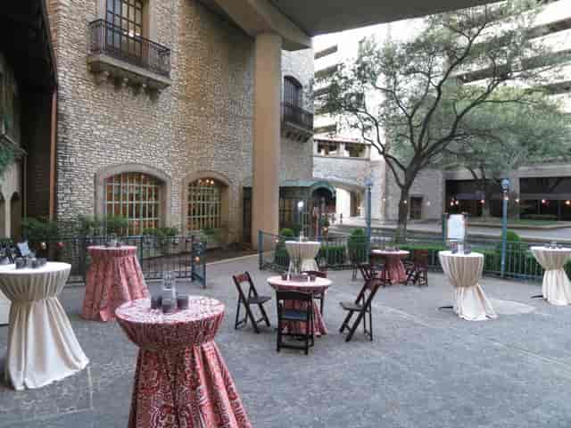 Indoor Venetian Reception Ballroom with elegant cocktail tables for events and gatherings.