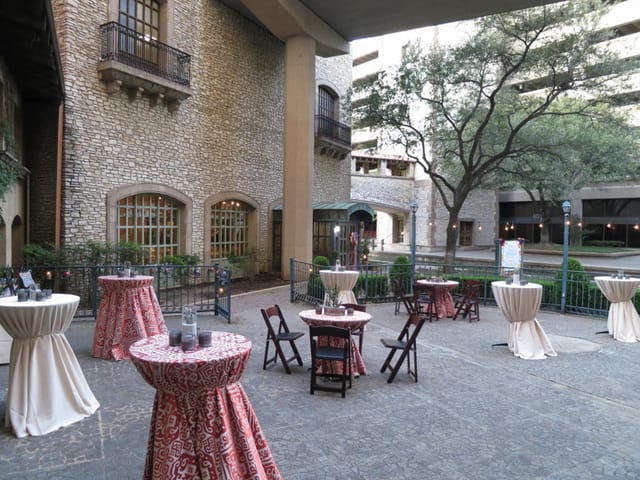 Indoor Venetian Reception Ballroom with elegant cocktail tables for events and gatherings.
