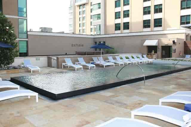 Outdoor infinity pool at The Highland Dallas, perfect for networking events and relaxation.