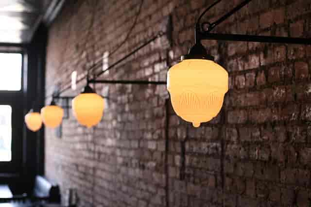Warm dining area with pendant lighting in Blind Butcher - perfect for gatherings and events.