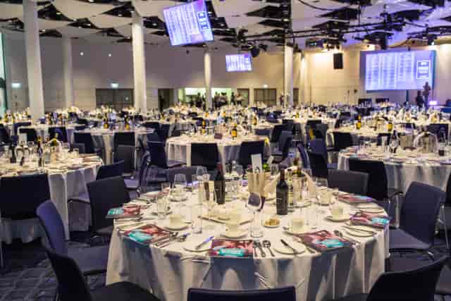 Elegant banquet setup in Wembley Stadium's Great Hall for a professional awards ceremony.