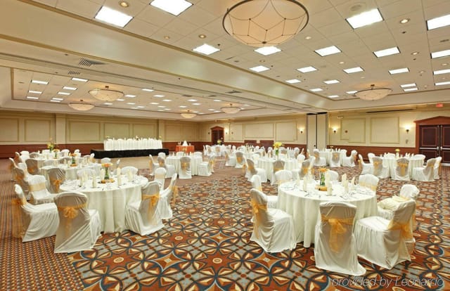 Banquet hall at Staybridge Suites, Dallas: elegant round tables for weddings or corporate events.
