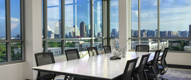Modern conference room with skyline view at Canopy by Hilton Dallas for corporate events.