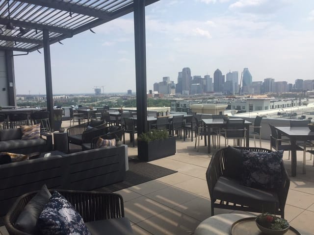 Rooftop Lounge at Canopy by Hilton, stylish venue with city skyline for upscale events.