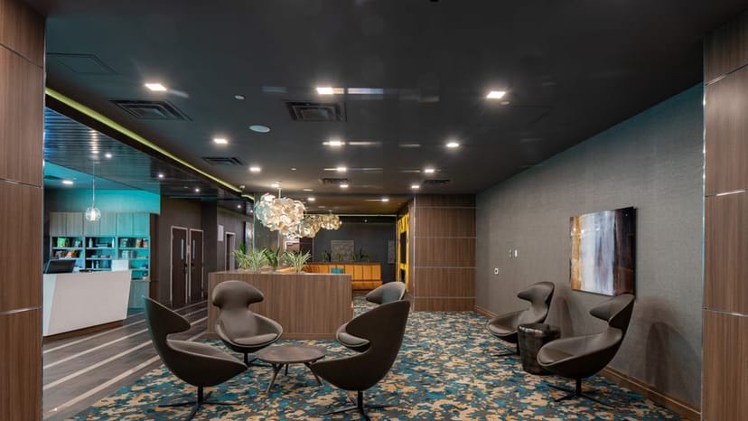 Modern meeting room with 75" Smart TV, perfect for networking events in Dallas.