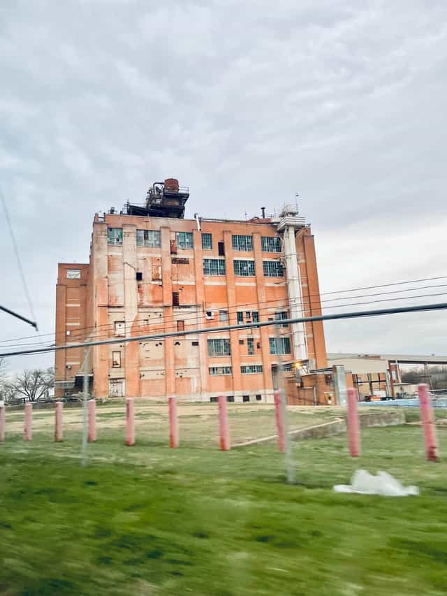 Industrial venue with rugged exterior ideal for creative events and art installations.