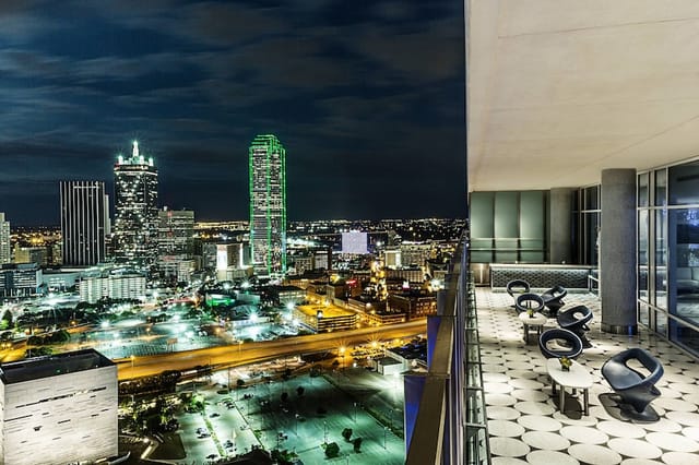 W Dallas Great Room 2 at night, featuring urban skyline views for upscale events.