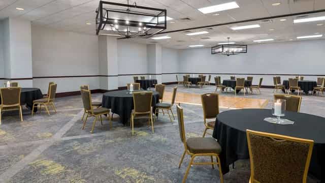 Meeting Room at Embassy Suites Dallas, round tables, ideal for corporate events and workshops.