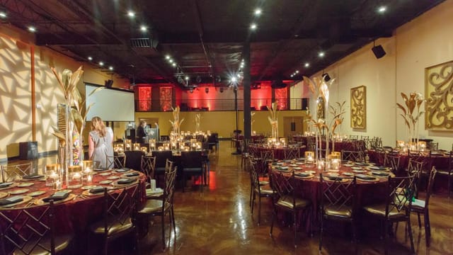 Elegant event space with round tables, perfect for corporate gatherings and upscale parties.