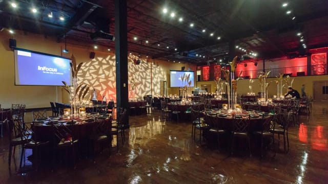 Elegant ballroom setup for formal dinner, perfect for corporate events and celebrations.