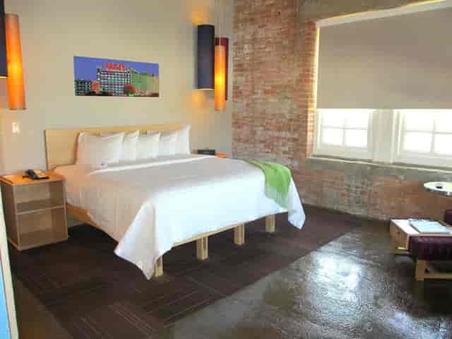 Modern Haven Room at Canvas Dallas Hotel, perfect for event attendees' relaxation.