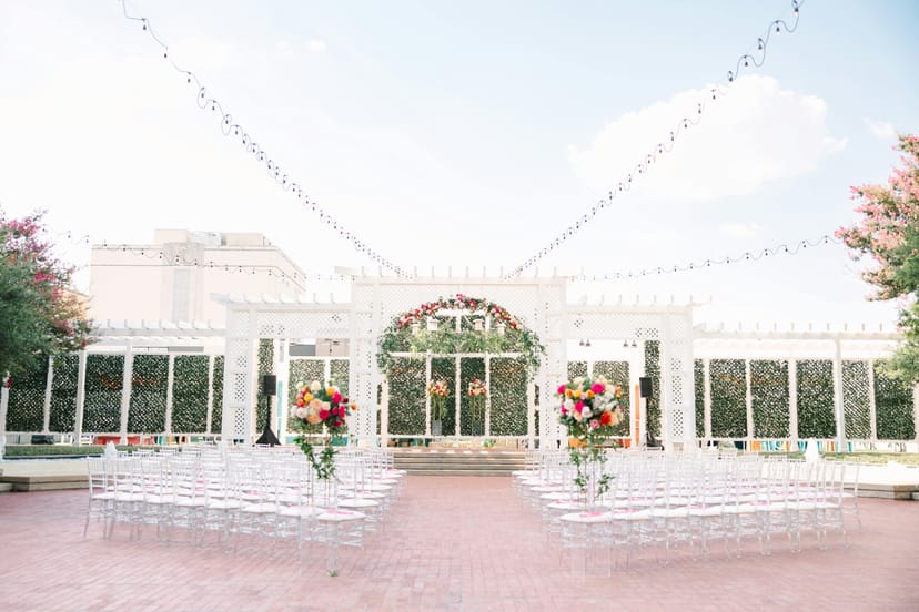 Outdoor wedding venue at Worthington Renaissance with elegant seating and floral displays.