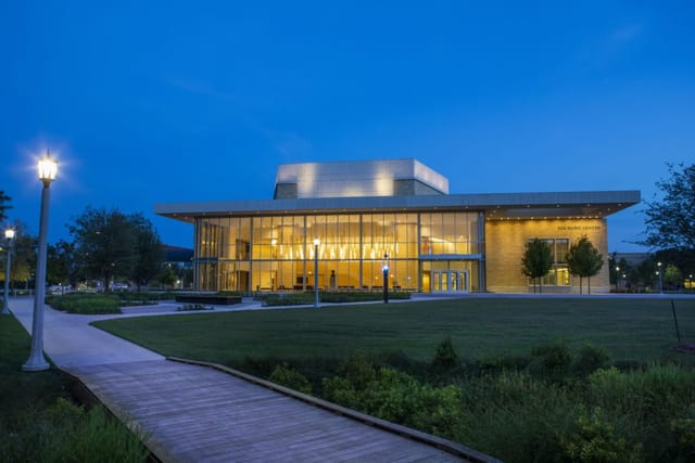 Van Cliburn Concert Hall with glass windows, perfect for conferences and galas.