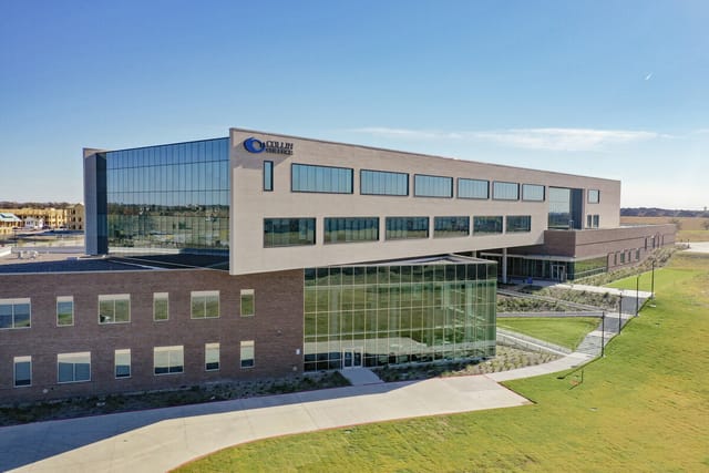 Modern conference room at Collin College with glass windows for corporate events.