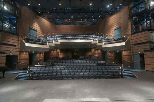 Modern lecture hall with tiered seating for conferences and workshops at Collin College.