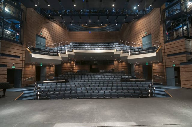 Modern lecture hall with tiered seating for conferences and workshops at Collin College.