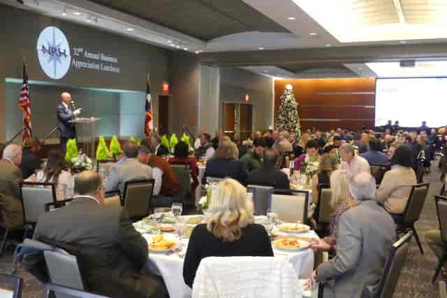 Corporate luncheon in Grand Hall with elegant tables and engaged audience.