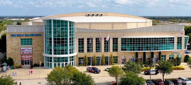Modern convention center with glass facade, ideal for corporate events in Texas.