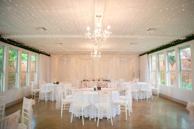 Elegant event space with fairy lights, perfect for weddings and gatherings.
