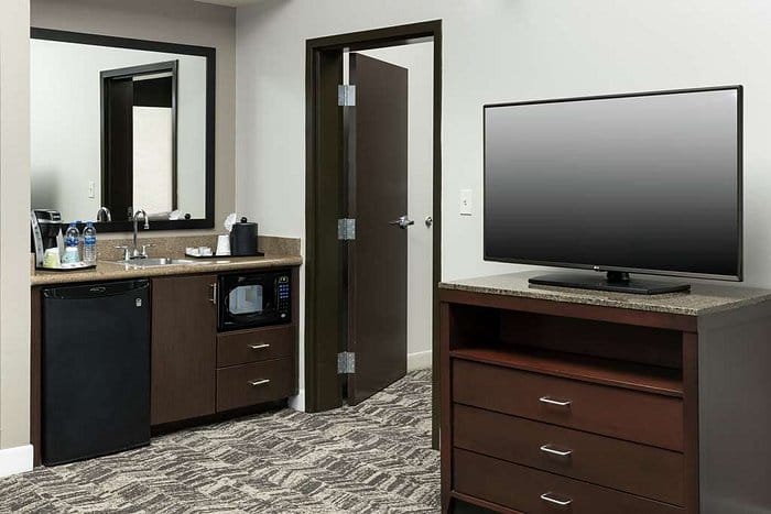 Meeting room at Hilton Garden Inn DFW with stylish decor, ideal for business events.